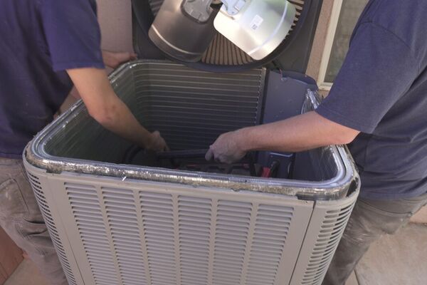 Five Star Mechanical technician accessing an attic air handler in Las Vegas, NV